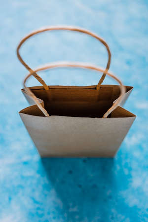 paper shopping bag shot from top down perspective at extremely shallow depth of field, concept of...