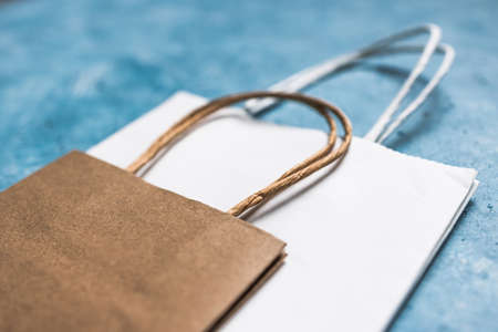 paper shopping bags in different sizes and colours, concept of branding and competition in the retail industryの写真素材