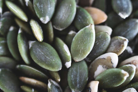 pumpkin seeds close-up shot of pantry ingredients, concept of simple toppings to flavour your dishesの写真素材