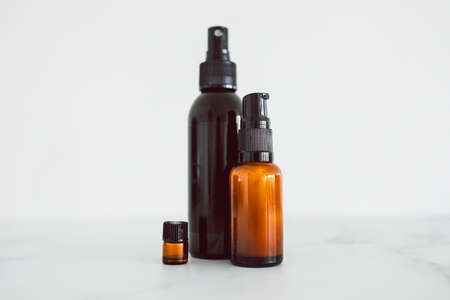 natural beauty and organic ingredients in skincare, apothecary skincare bottles on white marble...