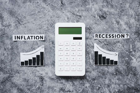 inflation and recession in economy, conceptual image with texts and graphs showing prices going up...