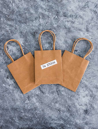 In stock text on top of shopping bags, concept of shopping and retail