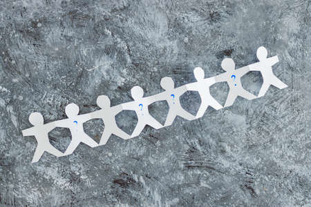staff shortages and business struggling after the pandemic conceptual image, paper people chain with...