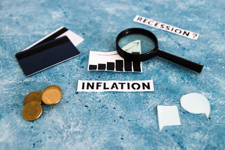 inflation text and graph showing prices going up with magnifying glass coins payment cards and comic...