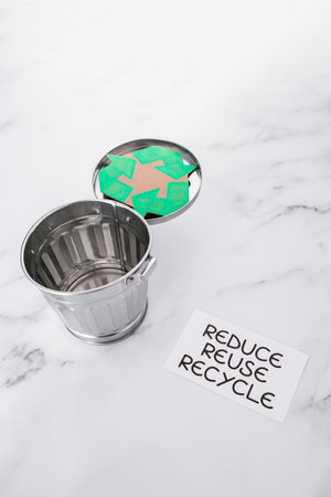 reduce reuse recycle sign with mini trash can and recycle icon, concept of sustainability and...