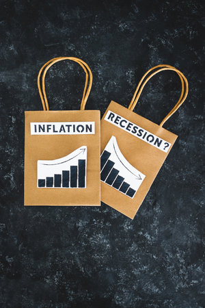 inflation and recession in economy, conceptual image with texts and graphs showing prices going up...