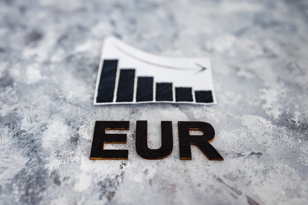 currency exchange rate conceptual image, graph showing negative growth with EUR text underneath it...