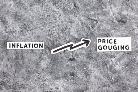 inflation or price gouging text with arrow representing prices going up, concept of economy after the pandemicの写真素材