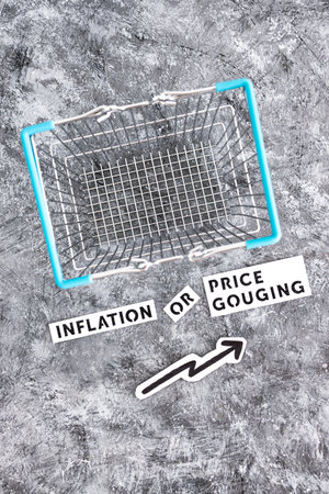 inflation or price gouging text with shopping basket and arrow representing prices going up, concept of economy after the pandemicの写真素材