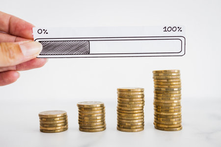 stacks of progressively increasing coins with hand holding  progress bar loading icon, concept of...