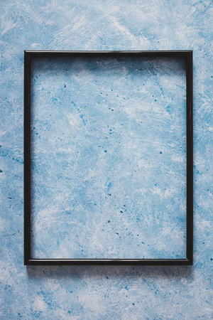 black rectangular picture frame mock-up with copy space for yout text or image on top of hand...