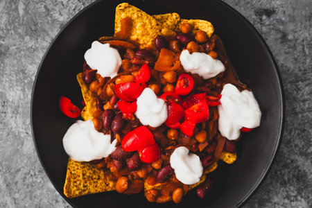healthy  bean nachos with tomato salsa and coconut yoghurt, healthy vegan food recipesの写真素材