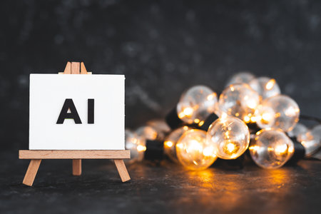 AI text on canvas on easel with light bulbs around it, art and machine learning concept, image NOT generated with AIの写真素材