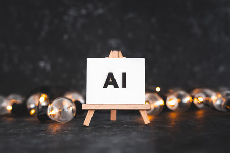 AI text on canvas on easel with light bulbs around it, art and machine learning concept, image NOT generated with AIの写真素材