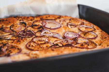 homemade Italian focaccia with onion topping, healthy vegan food recipesの写真素材