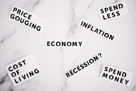 Inflation and recession conceptual image, economic terms scatered on marble deskの写真素材