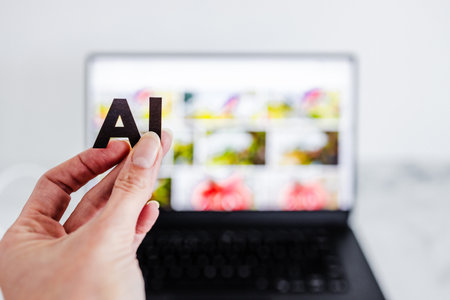 AI text in front of laptop bokeh with out of focus images, concept of Artificial Intelligence creating generative content based on art made by human authorsの写真素材