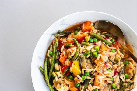Mediterranean risoni with green beans mixed vegetables and tomato sauce