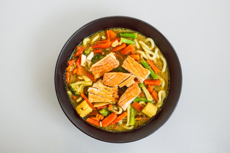 green curry vegetable noodles with pan-fried tofu, healthy food recipesの写真素材