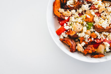 nourishing salad with white beans, roasted sweet potato, tomato, avocado, and feta, perfect for...