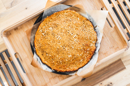 healthy chickpea flour flatbread inspired by southern france socca recipe, served on a wooden tray,...