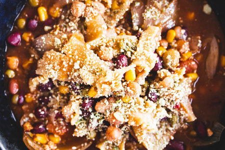 homemade onion soup with beans, corn, and parmesan topping, a hearty and wholesome vegetarian meal...