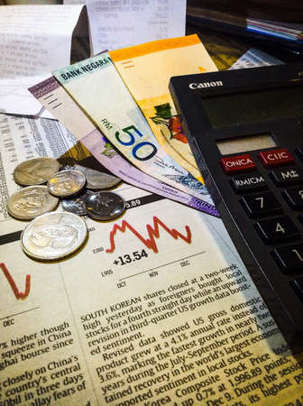 Business investment concept and share market with calculator money の素材