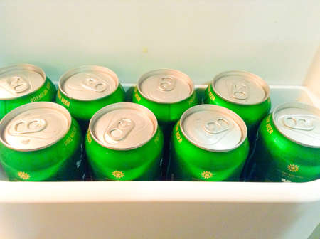 Set of beer cans in the fridge