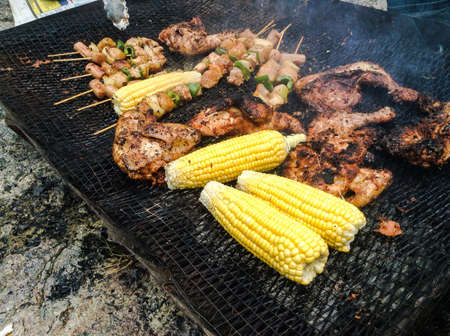 Chicken meat and corn on grillの素材