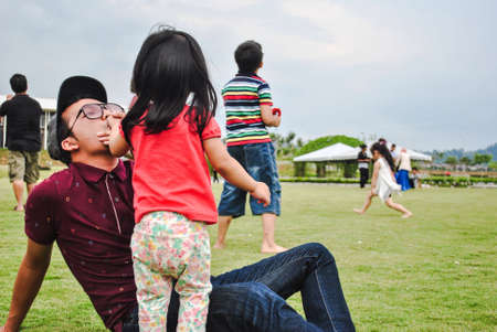 Father and his daughter at a parkの素材