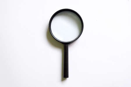 Magnifying glass isolated on white background. Concept of investigation,exploration,searching,finding,checking,inspecting data or information. Copy space or for blog title and header.の写真素材
