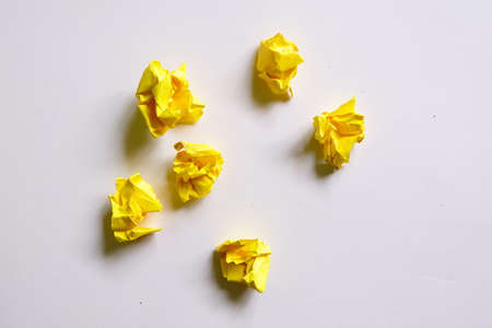 Top view of six yellow crumpled paper isolated on white background.の写真素材