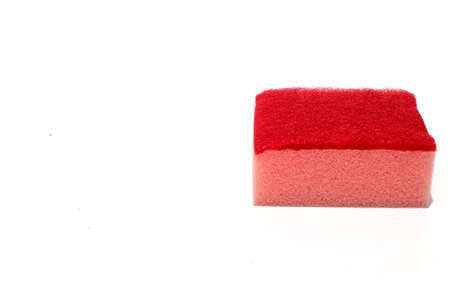 Red scouring pad and sponge isolated on white background for background and add text message.scouring pad and sponge is a cleaning tool used for scouring a surface and cleaning a dishes after cooking.の写真素材