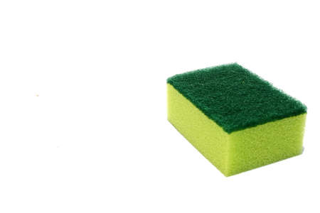 Green scouring pad and sponge isolated on white background with copy space.scouring pad and sponge is a cleaning tool used for scouring a surface and cleaning a dishes after cooking.の写真素材