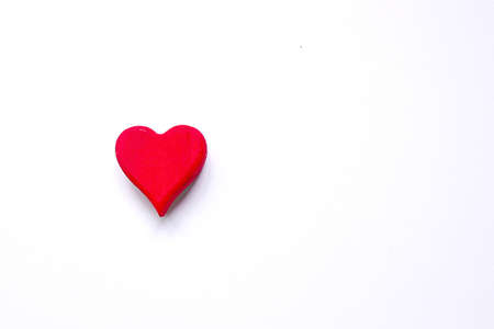 Top view of red wooden handcraft heart symbol with copy space for text or on white background.  Valentine's day theme.の写真素材