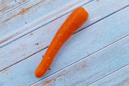 Top view of carrot on wooden background.の写真素材