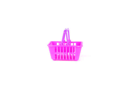 Purple and pink toy basket or shopping cart isolated on white background.の写真素材