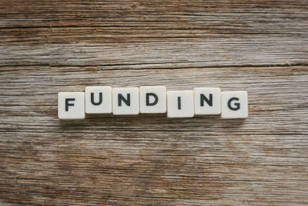 Word Funding alphabet on woodenの写真素材