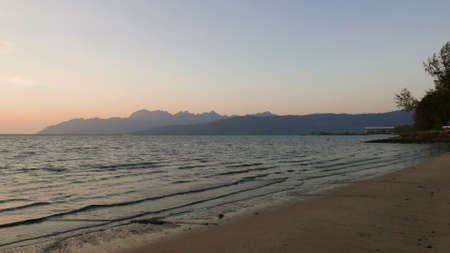 Sunset view of a beach,sea and mountain at Pulau Langkawi Kedah,Malaysia.