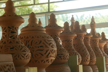 Selective focus of Handmade traditional Malay craft known as 'labu sayong'.It is a hand made water storage container. Clay pottery arts.の写真素材