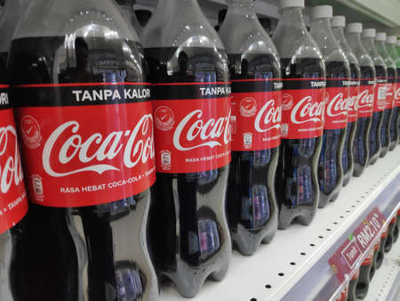 KULIM,MALAYSIA - MARCH 13TH,2020 : Coca Cola brand soft drink on display for sell at a supermarket shelf.のeditorial素材