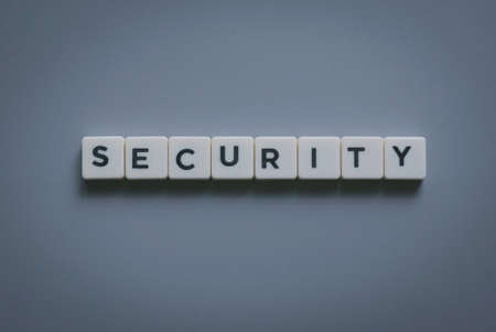 Security word made of square letter word on gray background.の写真素材