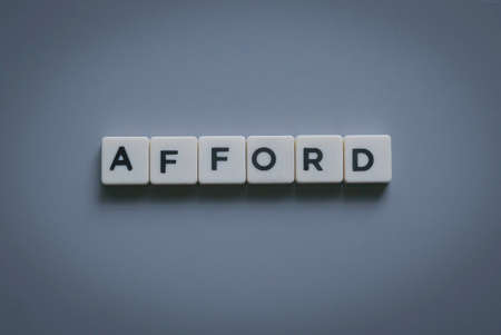 Afford word made of square letter word on gray background.の写真素材