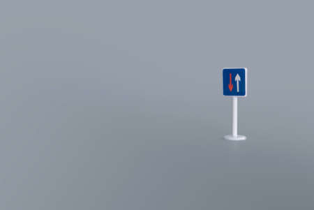 A sign with arrow move up and down on gray background with copy space.の写真素材