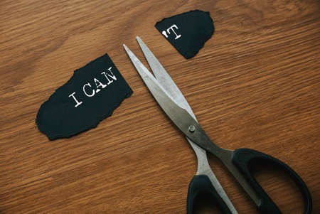 Motivational concept. Scissors cutting word I CAN'T to I CAN.の写真素材