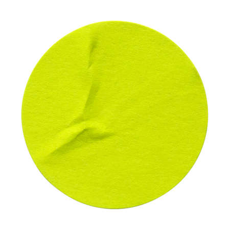 Green circle paper sticker label isolated on white background.
