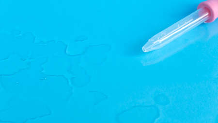 A water drop on a blue background.
