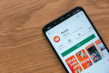 KULIM, MALAYSIA - CIRCA AUGUST, 2021 : A mobile phone with Reddit application on Google Play Store.