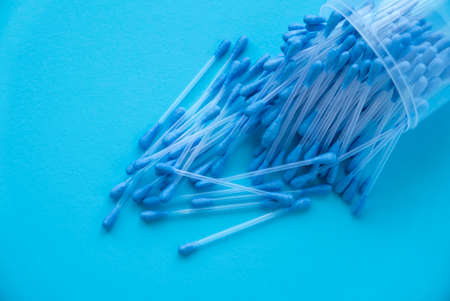 A cotton buds on blue background.の写真素材