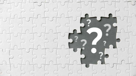 Top view of an empty space of jigsaw puzzle fill with question symbol.の写真素材